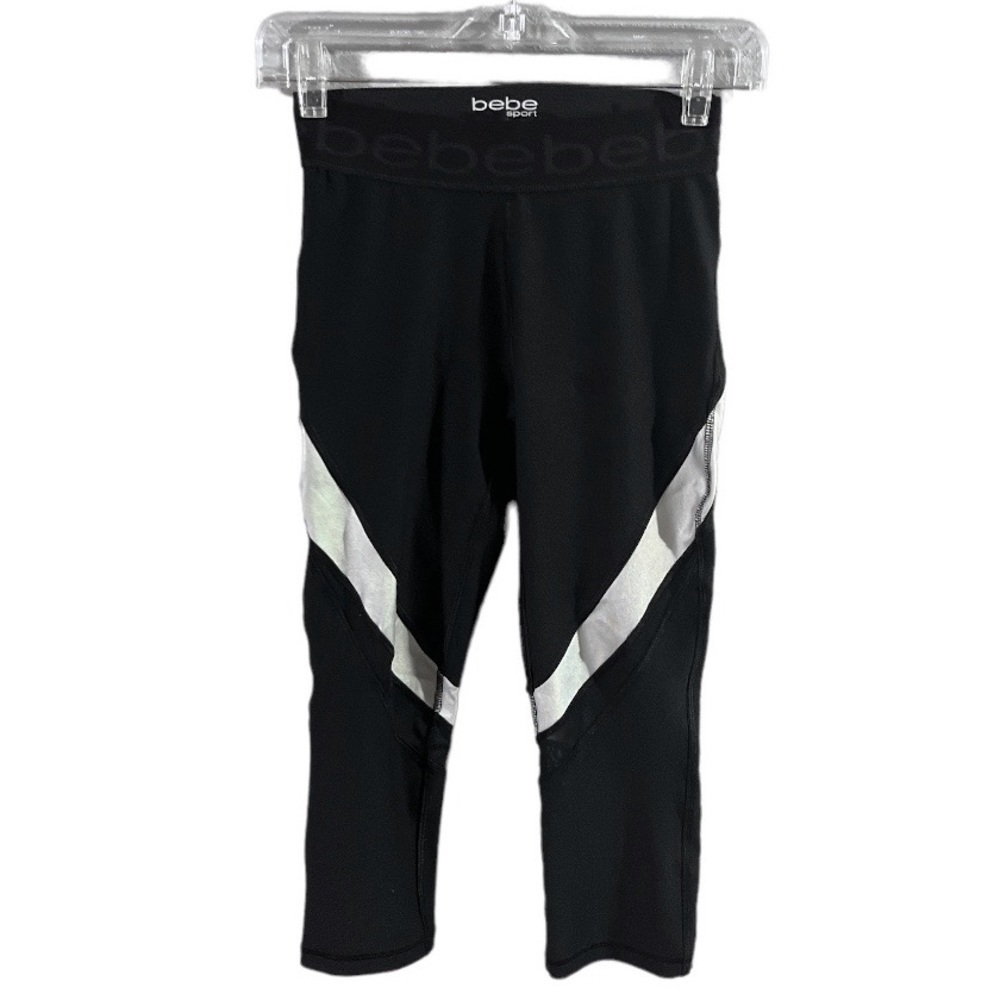 NWOT Bebe sports black and silver stripes capris